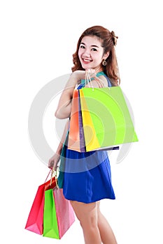Shopping.Portrait of young happy smiling woman with shopping bags