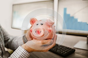 Man holding piggy bank