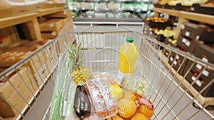 Shopping in the supermarket, filling the trolley with groceries, hyperlapse