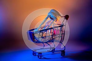 Shopping Time Concept - Cart and Clock or Hourglass. Creative lighting