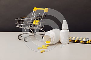 Shopping trolley with compounded prescription medications shipped from a mail order pharmacy on the table