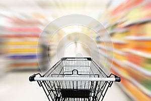 Shopping trolley in department store with consumer goods product