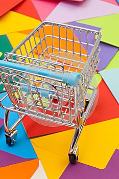 Shopping trolley and different envelopes on the desk