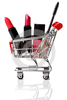 Shopping trolley with make-up products inside