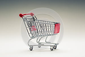 Shopping trolley. Shopping cart. Shopping trolley on multi collored background. Free space for your informations photo