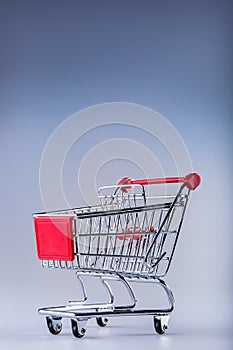 Shopping trolley. Shopping cart. Shopping trolley on muti collored background.
