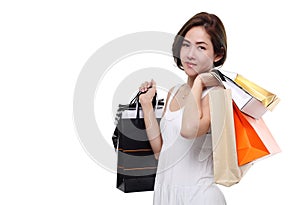 Shopping woman asian happy smiling holding shopping bags isolated on white background