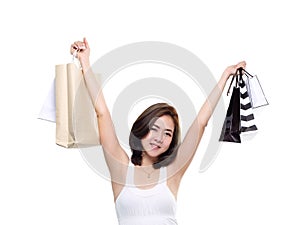 Shopping woman asian happy smiling holding shopping bags isolated on white background