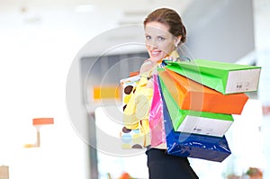 Shopping woman with color bags