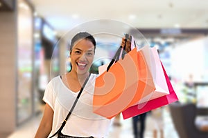 Shopping woman holding shopping bags with copy space