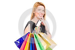 Shopping woman holding shopping bags and credit or debit card