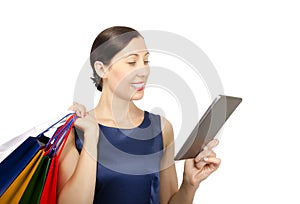 Shopping woman looking at tablet computer