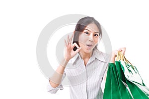 Shopping woman showing ok hand gesture