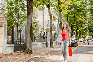 Shopping woman walking though avenues