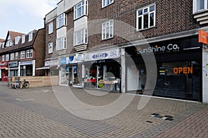 Shops along the Corbets Tey high street in Upminster, East London, UK