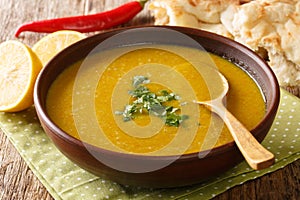 Shorbat Adas Middle Eastern Lentil puree soup closeup in the bowl. Horizontal photo