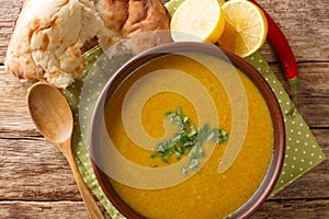 Shorbat Adas Middle Eastern Lentil puree soup closeup in the bowl. Horizontal top view photo