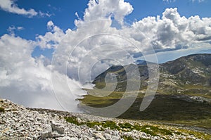 Shore with clouds in the mountain