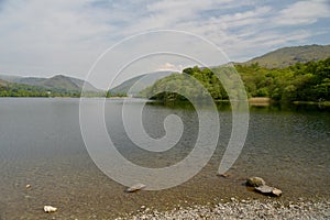 Shore of Grasmere looking towards Helm Crag in Lake District