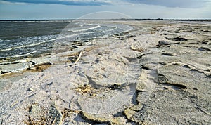 The shore of a hyperhaline lake covered with self-precipitating salt Sodium chloride, California