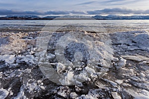 Shore ice piling up Lage Laberge Yukon Canada