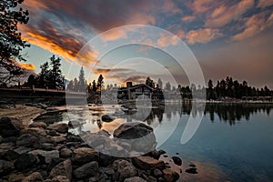 Shore of Payette Lake in McCall Idaho with sunset colors over hotel