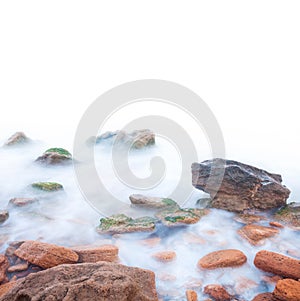 Shore of the sea, rocks and flowing water - white background