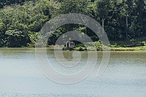 Shore side trees and hut in Gatun Lake Panama canal