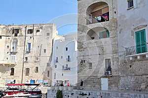 on the shore in the town of Monopoli, old buildings of an Italian town, Italy, Puglia region