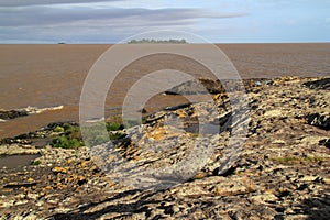 From the shoreline of Colonia Del Sacramento, Uruguay, can be seen a small island, the Isla de Farallon photo