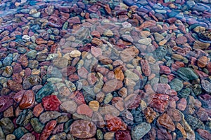 The shoreline of Lake McDonald in Glacier National Park