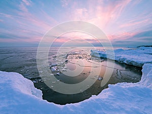 Shoreline of Lake Superior in winter at sunset photo