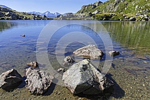 Shoreline of the mountain lake in Pas de la Coche