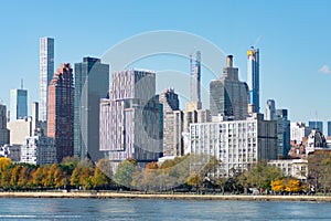Shoreline of Roosevelt Island with the Midtown Manhattan Skyline in New York City during Autumn