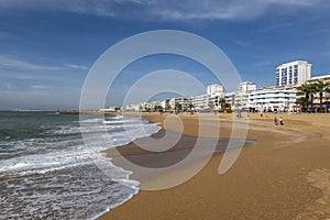 Shoreline view of Quarteira beach photo