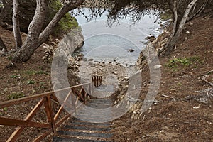 Shoreline wooden path. Cami de ronda. Lescala, Girona. Catalonia, Spain photo