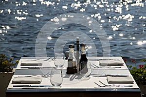 Shoreside table setting with blurred sea