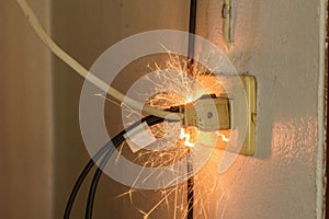 Short circuit causing sparking Caused by substandard electrical appliances Therefore causing damage and danger photo
