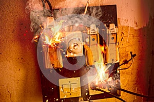 Short circuit fire burn danger of old electrical wire plug and broken circuit breaker