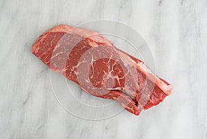 Short cut rump steak on a cutting board