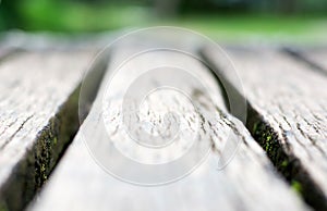 Short depth of field gray wooden boardwalk weathered