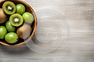 Short food supply chains SFSCs.From garden to plate concept.A bowl of fresh kiwis on the wood table.Flat lay,Copy space