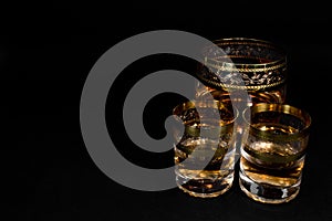 Short Glass and glass of dark red whiskey, brandy or .bourbon