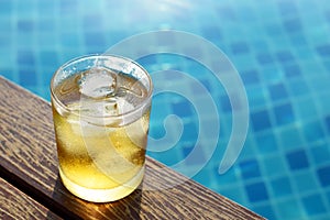 A short glass of ice beer at pool