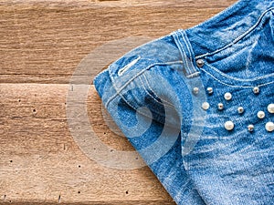 Short jean on wood background