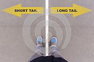Short or long tail marketing text on asphalt ground, feet and sh