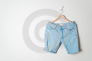 Short pants jeans hanging on hanger