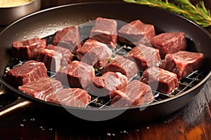 short ribs on a skillet being infused with a baste