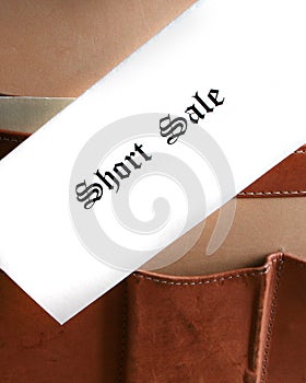 Short sale documents in a briefcase - vertical