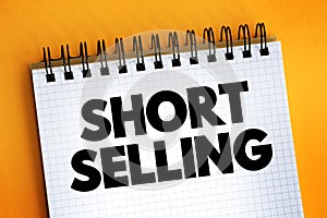 Short Selling - sale of a stock you do not own, text concept on notepad